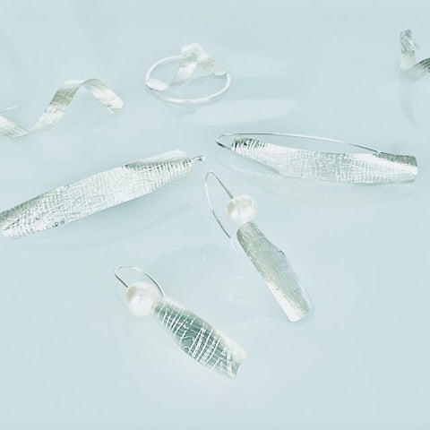 Soaring wing pearl earrings